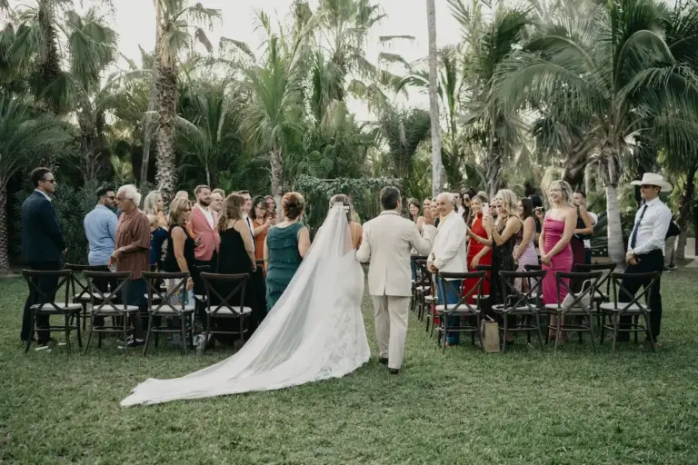 Wedding ceremony among the palm trees at Acre Resort, Los Cabos