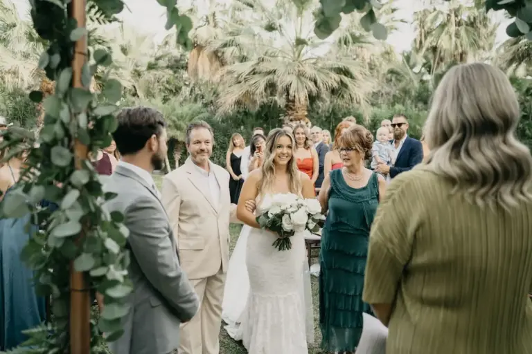 Wedding ceremony among the palm trees at Acre Resort, Los Cabos