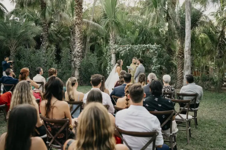 Wedding ceremony among the palm trees at Acre Resort, Los Cabos
