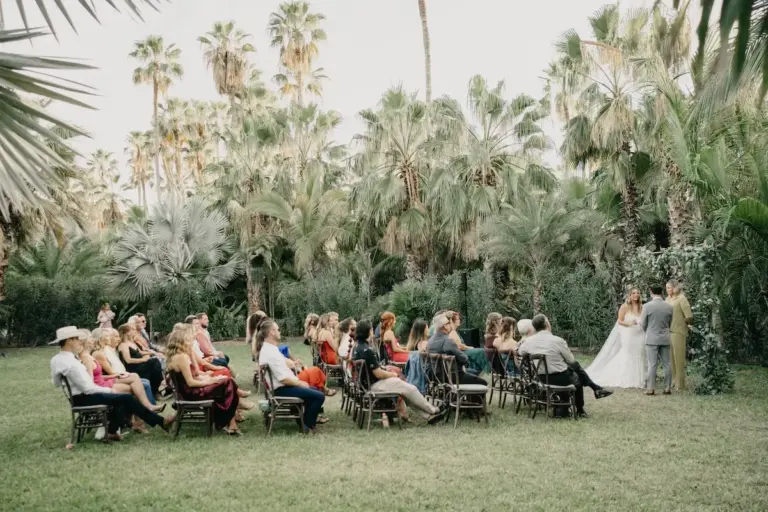 Wedding ceremony among the palm trees at Acre Resort, Los Cabos