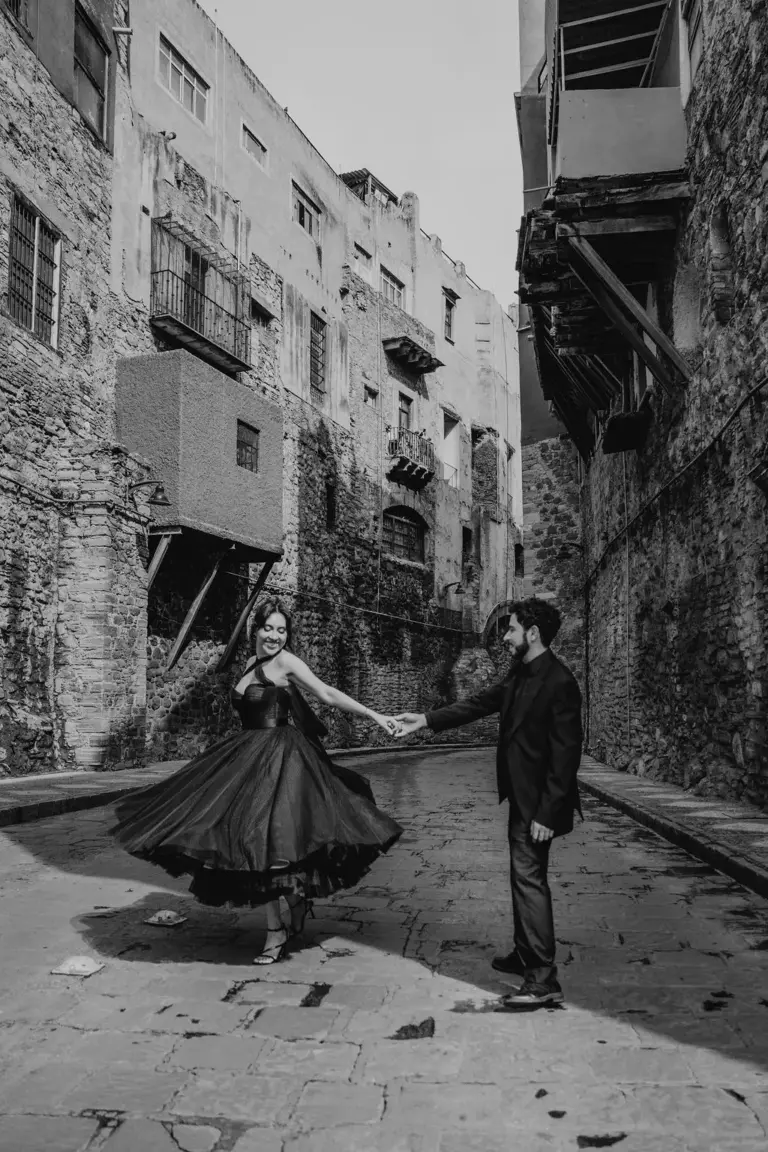 Guanajuato engagement black gown twirl orange alley