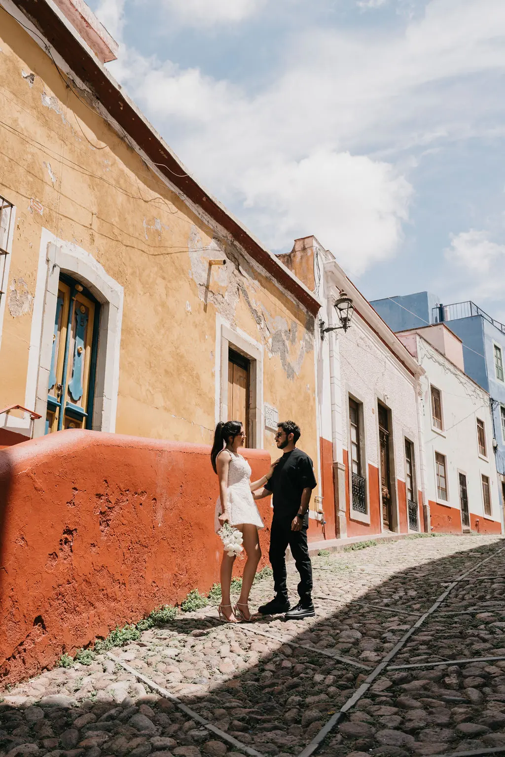 Guanajuato engagement orange wall alley rail tracks